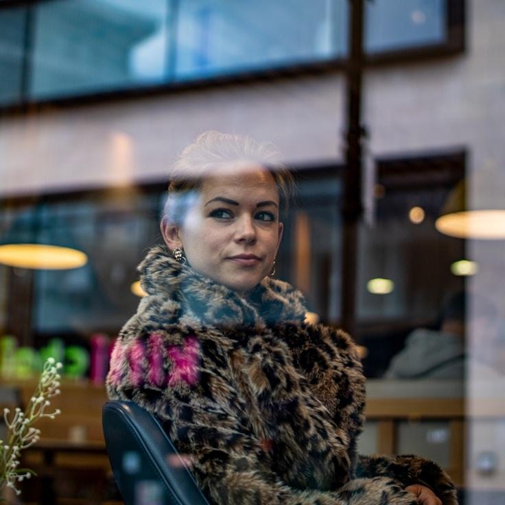 Kaveri Mehta, Lead Design Curator at TableLeafPulse, reviewing corporate floral arrangements